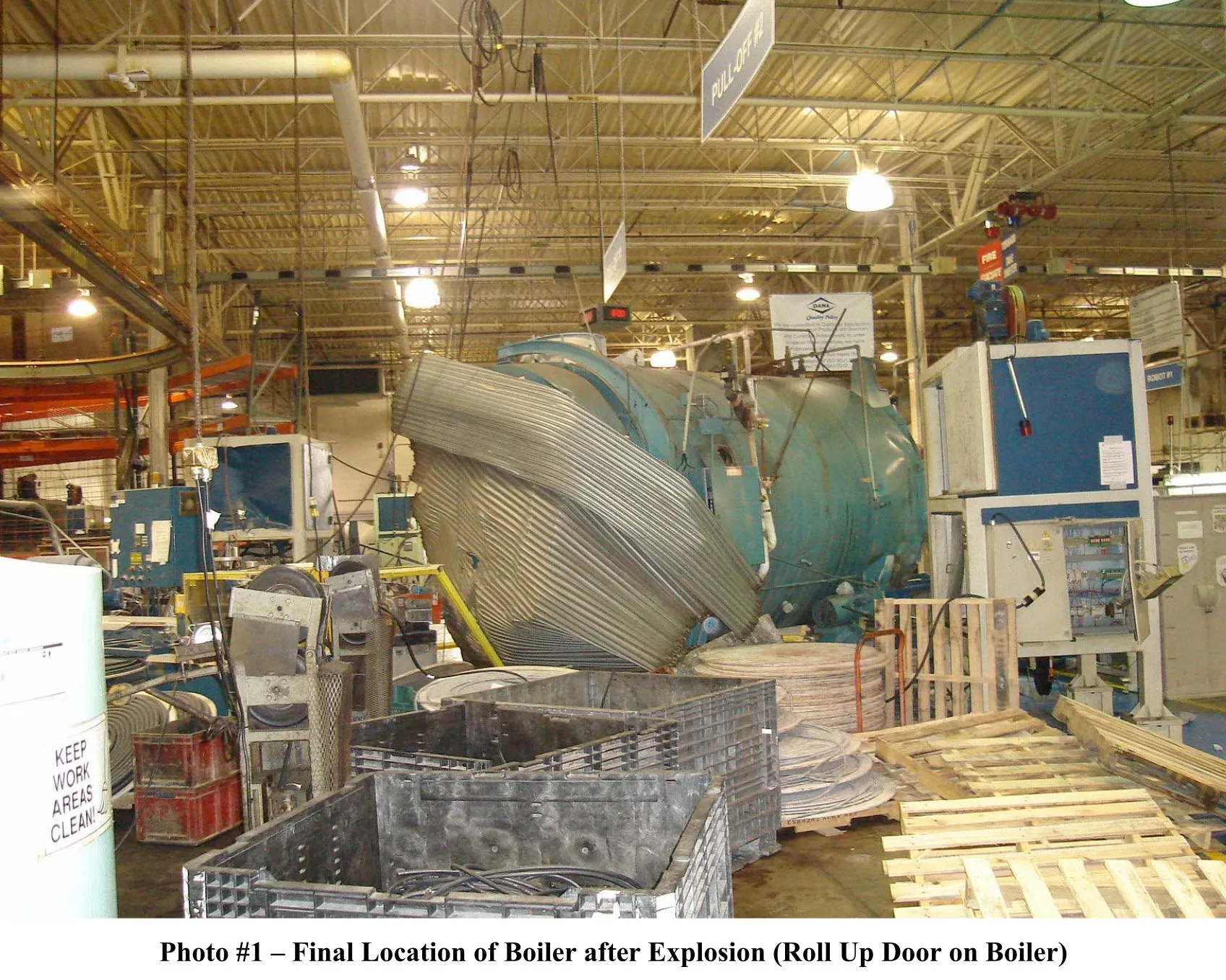 twisted boiler with rollup door twisted around on it - photo 1, final location of boiler.