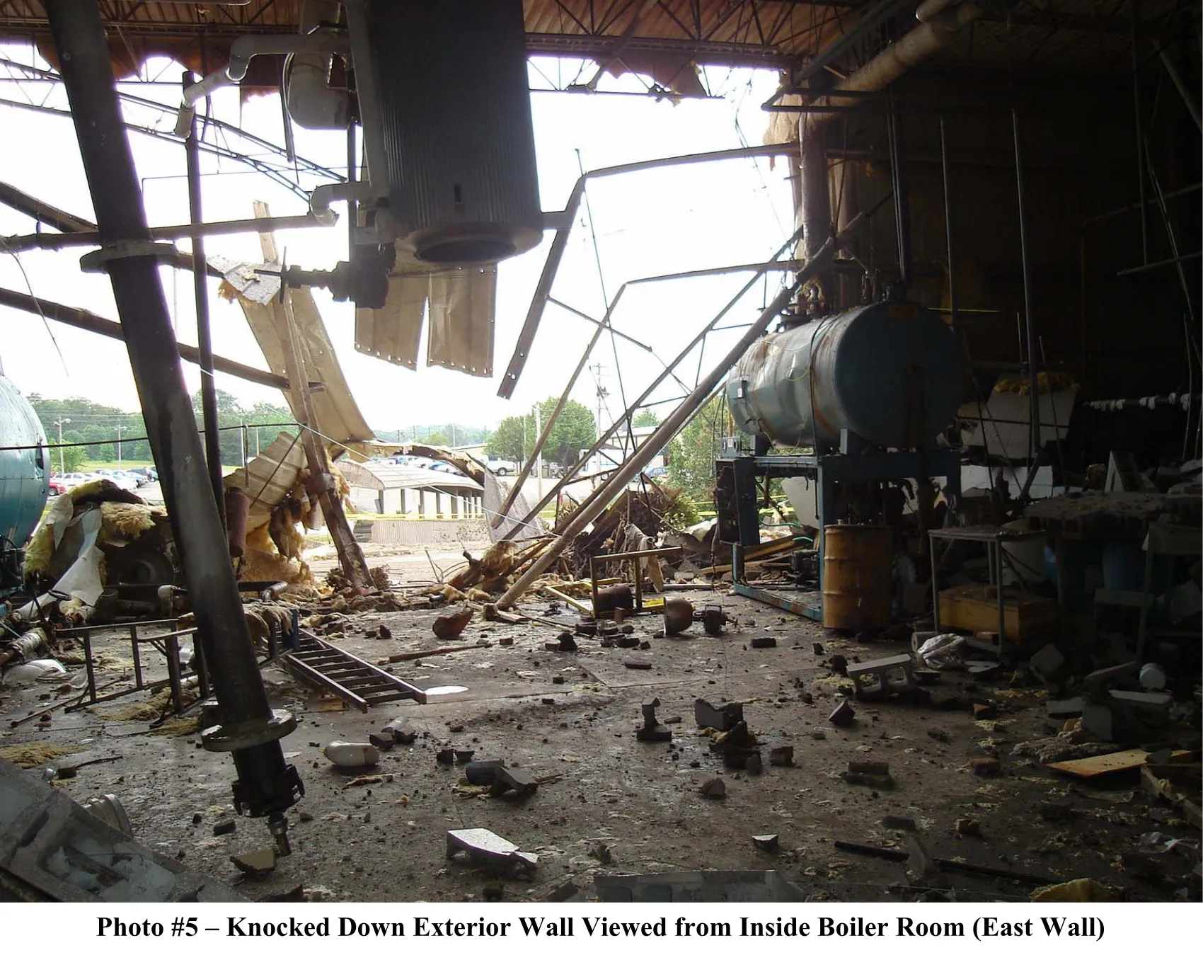 photo 5 - inside view of exterior boiler room wall to the outside blown open.