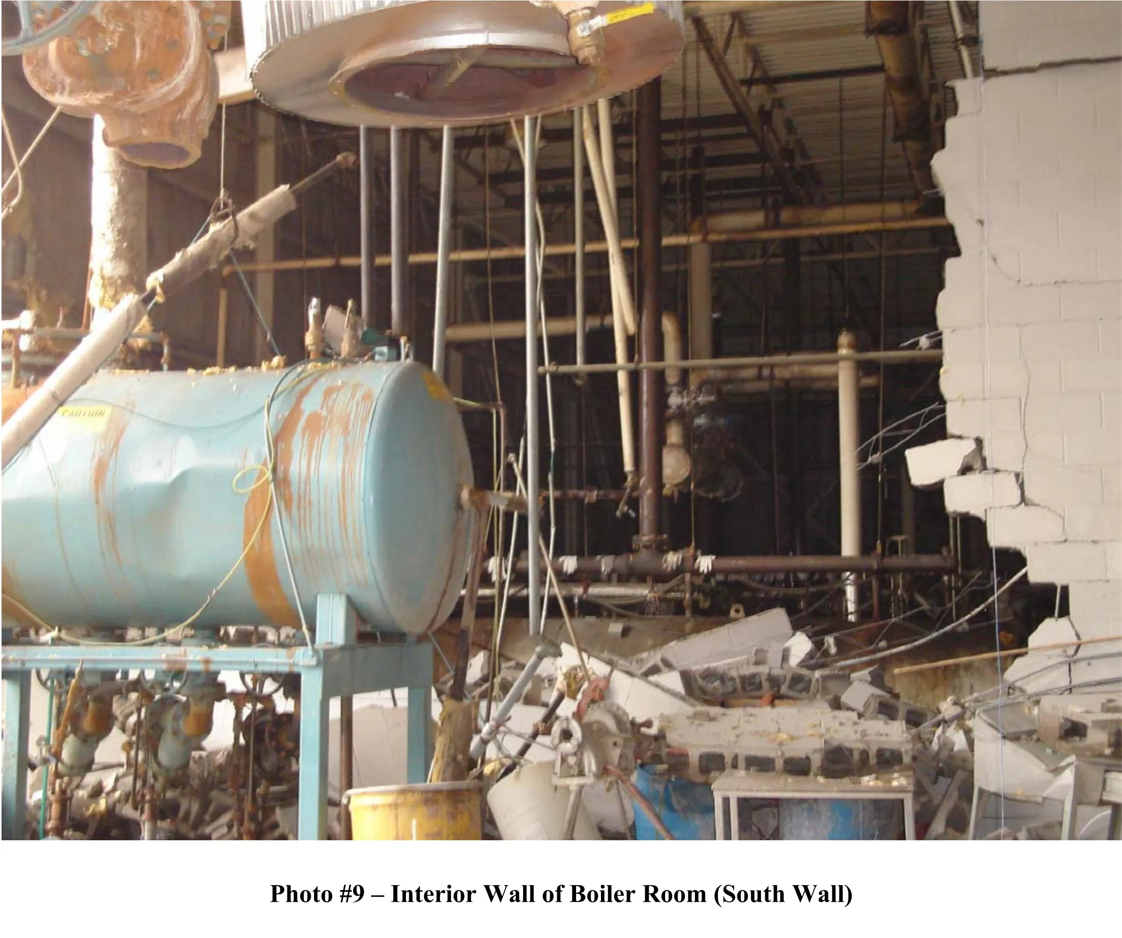 photo 9 - damaged interior concrete block interior wall of the boiler room.
